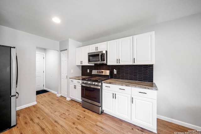 5902 Brambletree, San Antonio, TX 78247 - kitchen featuring stainless steel appliances, baseboards, decorative backsplash, and white cabinets