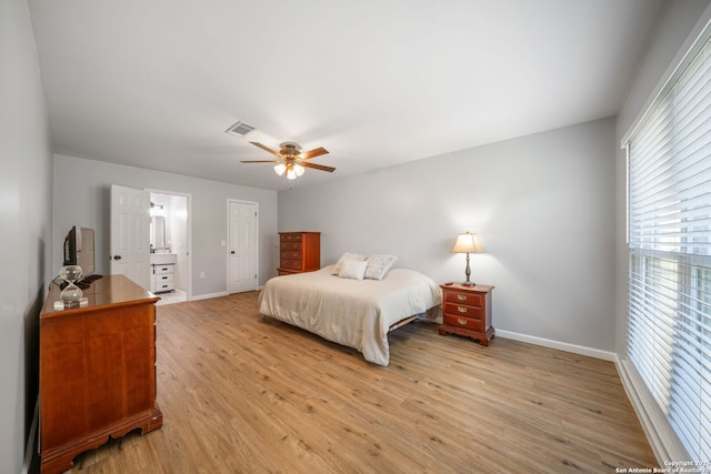 5902 Brambletree, San Antonio, TX 78247 - bedroom with multiple windows, baseboards, and light wood-style flooring