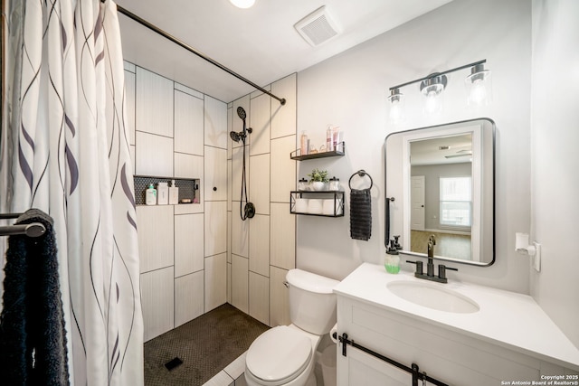 5902 Brambletree, San Antonio, TX 78247 - bathroom featuring tiled shower, toilet, and vanity