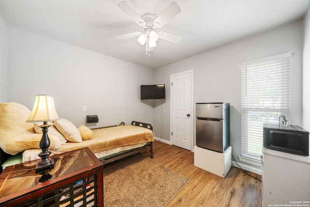 5902 Brambletree, San Antonio, TX 78247 - bedroom featuring light wood-style floors, baseboards, and a ceiling fan