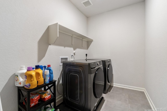 4540 Appaloosa, San Antonio, TX 78245 - laundry room with washing machine and dryer, baseboards, and tile patterned floors