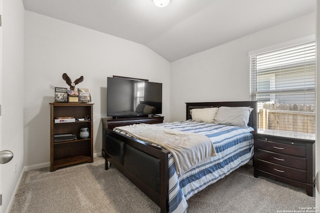 4540 Appaloosa, San Antonio, TX 78245 - bedroom featuring light carpet, lofted ceiling, and baseboards
