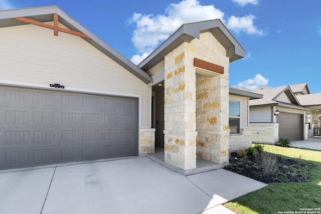 4540 Appaloosa, San Antonio, TX 78245 - view of front of home with stone siding, concrete driveway, and an attached garage