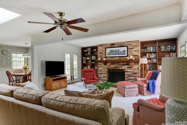 5810 Windvale, Windcrest, TX 78239 - living room with carpet flooring, ceiling fan, a textured ceiling, built in features, and a brick fireplace