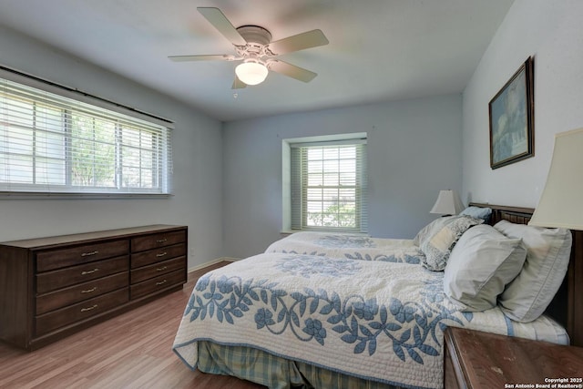5810 Windvale, Windcrest, TX 78239 - bedroom featuring light wood-type flooring and a ceiling fan