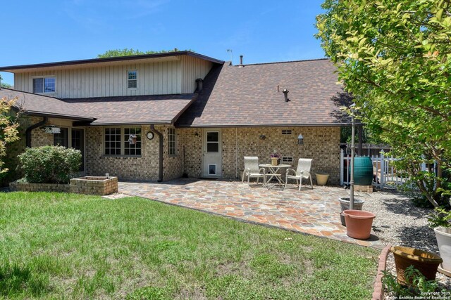 5810 Windvale, Windcrest, TX 78239 - back of property with a patio area, brick siding, and roof with shingles