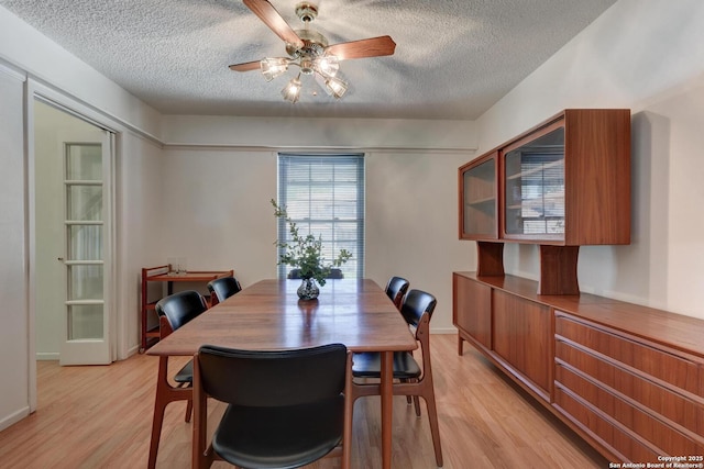 5810 Windvale, Windcrest, TX 78239 - dining area featuring a textured ceiling, light wood-style floors, and a ceiling fan