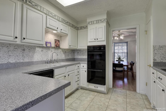 5810 Windvale, Windcrest, TX 78239 - kitchen featuring black appliances, a sink, backsplash, light tile patterned floors, and white cabinetry