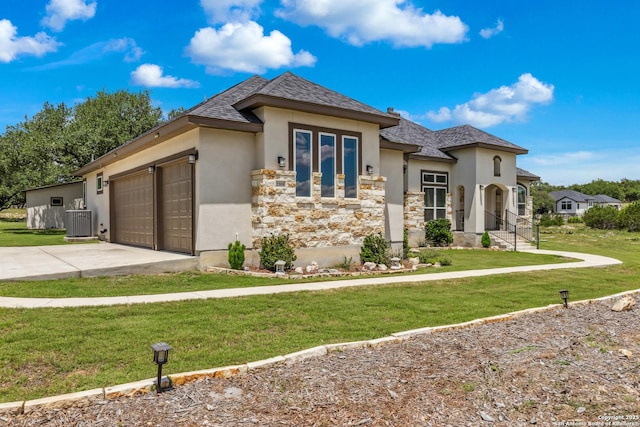 2319 Cascada, Spring Branch, TX 78070 - view of front of home with stucco siding, central AC unit, concrete driveway, stone siding, and a front lawn