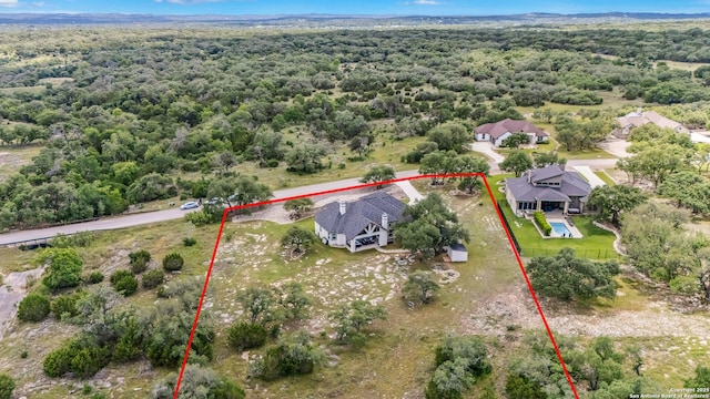 2319 Cascada, Spring Branch, TX 78070 - aerial view of property's location with property boundaries highlighted and a heavily wooded area
