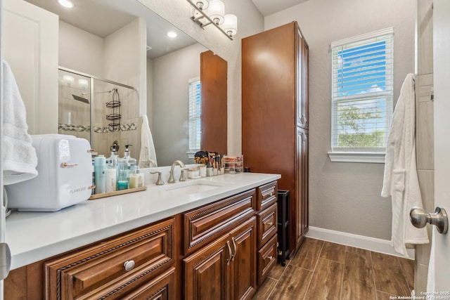 2319 Cascada, Spring Branch, TX 78070 - full bath with a shower stall, wood finished floors, baseboards, vanity, and recessed lighting