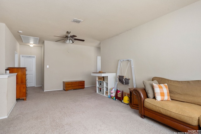 160 Jolie, Boerne, TX 78015 - carpeted living area featuring attic access, ceiling fan, and baseboards