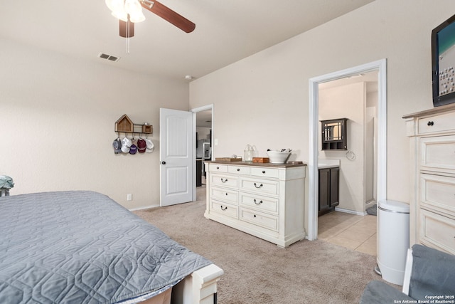 160 Jolie, Boerne, TX 78015 - bedroom with light colored carpet, ensuite bath, baseboards, and ceiling fan
