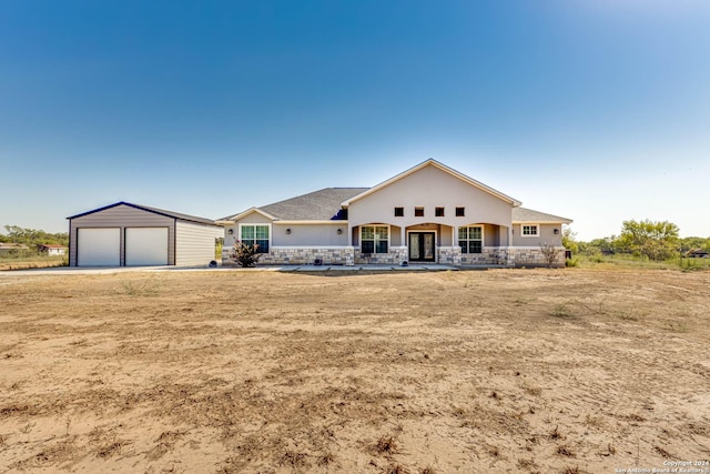 19146 Mcconnell Rd, Atascosa, TX 78002 - ranch-style home featuring stucco siding, french doors, and an outdoor structure