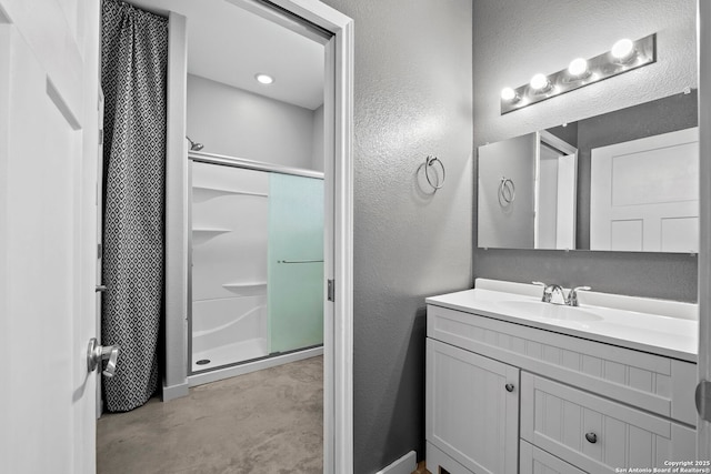 764 Zuehl Xing, La Vernia, TX 78121 - full bathroom with a textured wall, vanity, a shower, and concrete flooring