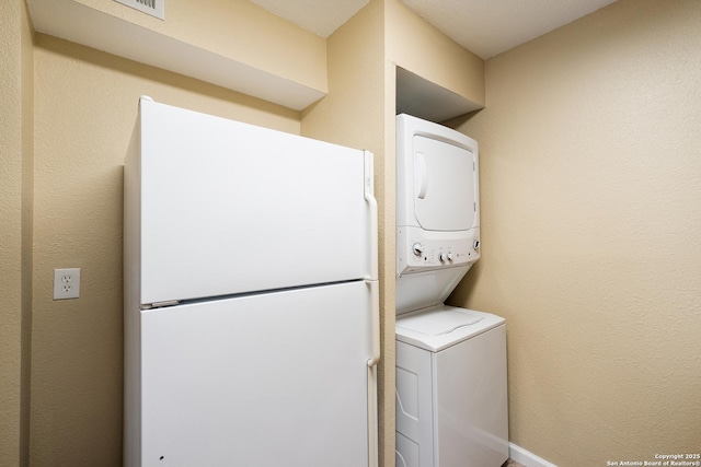 3243 Nacogdoches Rd Unit 501, San Antonio, TX 78217 - laundry room with stacked washing machine and dryer