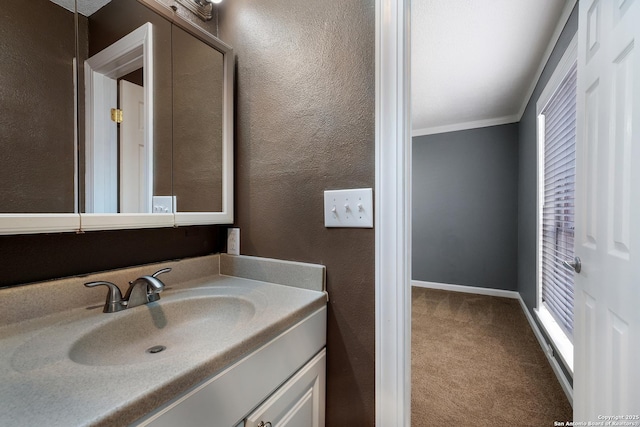 3243 Nacogdoches Rd Unit 501, San Antonio, TX 78217 - bathroom featuring ornamental molding, vanity, and a textured wall