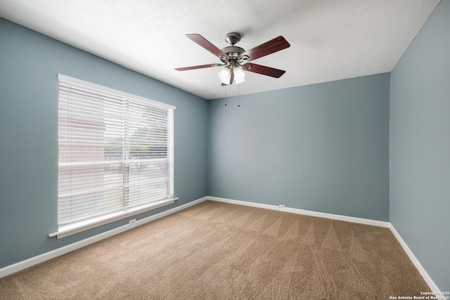 3243 Nacogdoches Rd Unit 501, San Antonio, TX 78217 - unfurnished room featuring carpet flooring, ceiling fan, baseboards, and a textured ceiling