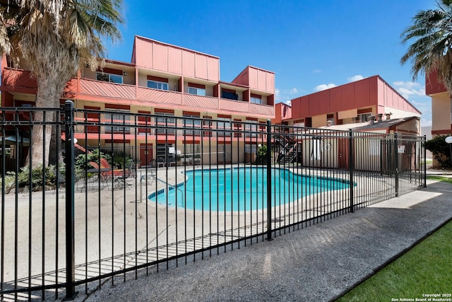 3243 Nacogdoches Rd Unit 501, San Antonio, TX 78217 - community pool with fence and a patio area
