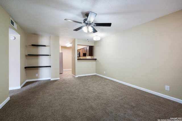 3243 Nacogdoches Rd Unit 501, San Antonio, TX 78217 - unfurnished living room featuring ceiling fan, carpet flooring, and baseboards