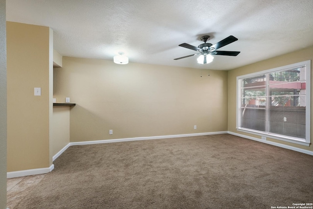 3243 Nacogdoches Rd Unit 501, San Antonio, TX 78217 - unfurnished room with carpet flooring, ceiling fan, baseboards, and a textured ceiling