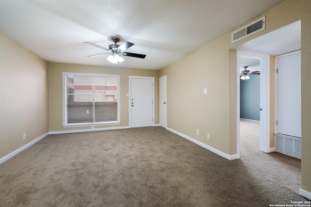 3243 Nacogdoches Rd Unit 501, San Antonio, TX 78217 - spare room with ceiling fan, carpet, a textured ceiling, and baseboards