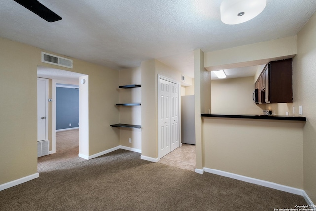 3243 Nacogdoches Rd Unit 501, San Antonio, TX 78217 - unfurnished room featuring carpet floors, baseboards, and a textured ceiling