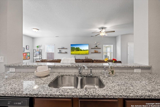 140 Whitetail Pass, San Antonio, TX 78253 - kitchen with open floor plan, a sink, plenty of natural light, a ceiling fan, and a textured ceiling