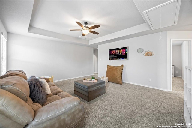 140 Whitetail Pass, San Antonio, TX 78253 - living room featuring attic access, a tray ceiling, carpet, and baseboards