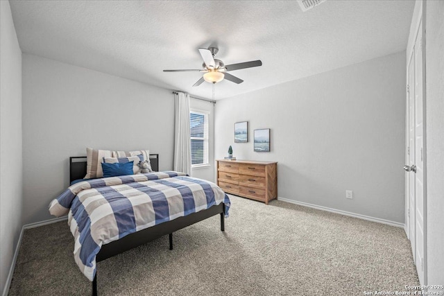 140 Whitetail Pass, San Antonio, TX 78253 - bedroom featuring carpet floors, a ceiling fan, baseboards, and a textured ceiling