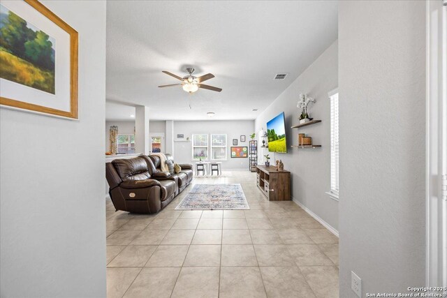 140 Whitetail Pass, San Antonio, TX 78253 - living area with a ceiling fan, light tile patterned flooring, and baseboards