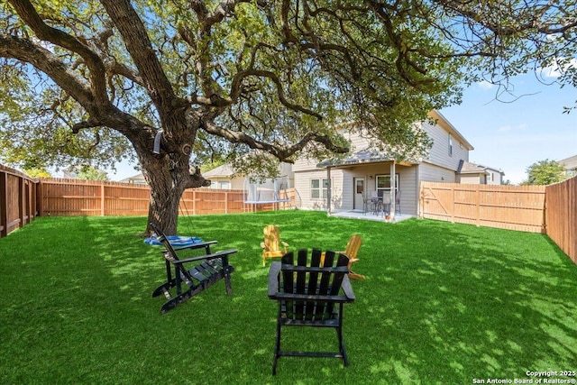 140 Whitetail Pass, San Antonio, TX 78253 - view of yard featuring a trampoline and a patio area