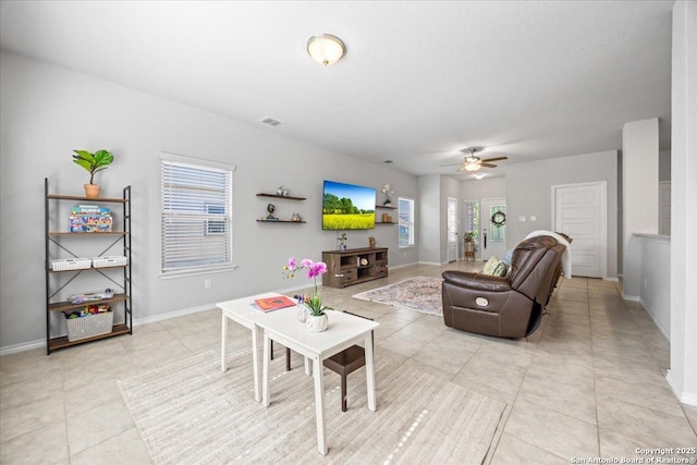 140 Whitetail Pass, San Antonio, TX 78253 - living area with ceiling fan, light tile patterned flooring, and baseboards