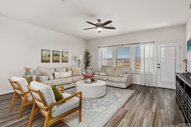10227 Amaryllis, Boerne, TX 78006 - living area featuring dark wood-type flooring, a ceiling fan, and baseboards