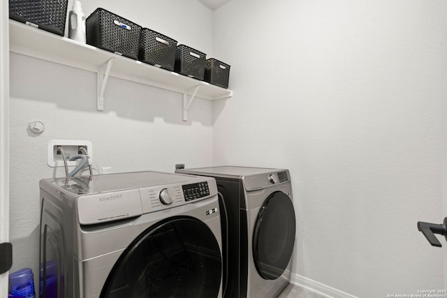 10227 Amaryllis, Boerne, TX 78006 - washroom featuring separate washer and dryer and baseboards
