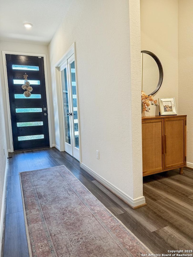 10227 Amaryllis, Boerne, TX 78006 - foyer entrance with wood finished floors, baseboards, and french doors