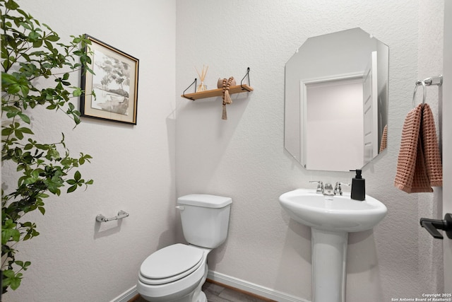 10227 Amaryllis, Boerne, TX 78006 - bathroom with toilet and baseboards