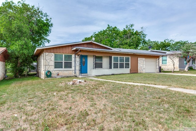 466 Shannon Lee, San Antonio, TX 78216 - view of front of property featuring an attached garage, a front yard, stone siding, and driveway