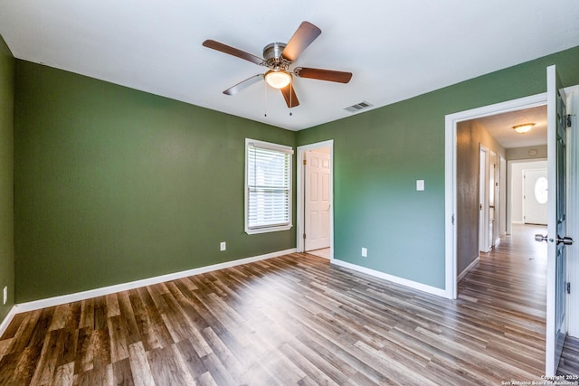 466 Shannon Lee, San Antonio, TX 78216 - unfurnished room with wood finished floors, a ceiling fan, and baseboards