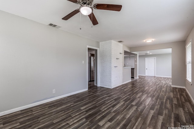 466 Shannon Lee, San Antonio, TX 78216 - unfurnished living room with dark wood finished floors, baseboards, and ceiling fan