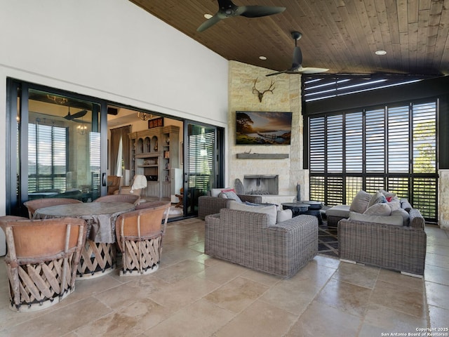 21214 W Tejas Trl, San Antonio, TX 78257 - view of patio / terrace with ceiling fan, an outdoor living space with a fireplace, and outdoor dining area