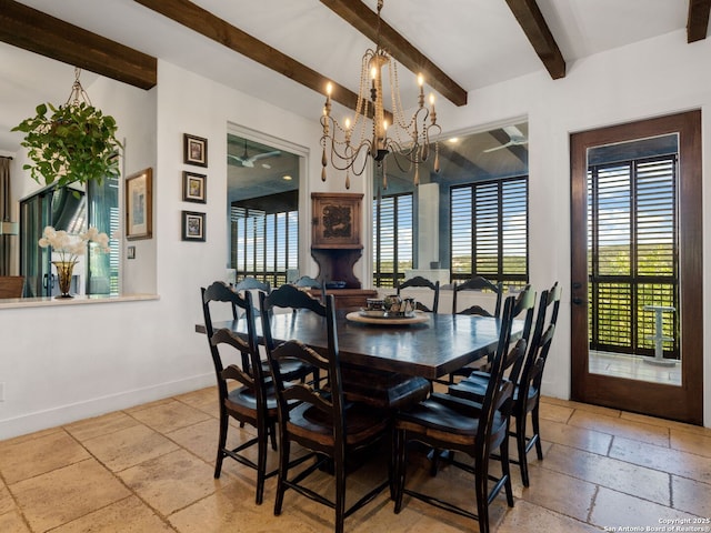 21214 W Tejas Trl, San Antonio, TX 78257 - dining area with beamed ceiling, stone tile floors, baseboards, a chandelier, and plenty of natural light