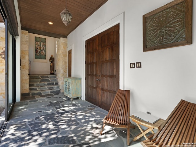 21214 W Tejas Trl, San Antonio, TX 78257 - view of exterior entry with stone siding, stucco siding, and a porch