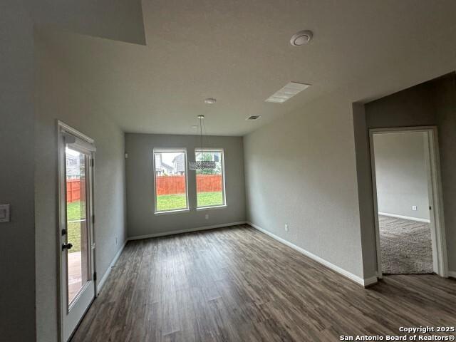 9536 Garrison Way, San Antonio, TX 78254 - unfurnished room with dark wood-style floors and baseboards