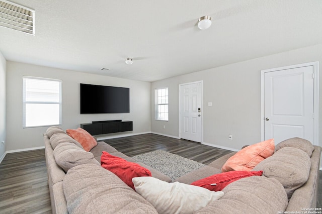 living room with wood finished floors and baseboards