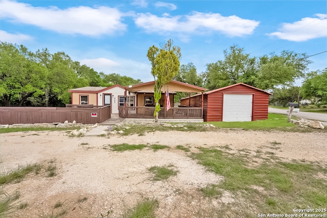 4590 Sir Arthur Way, Canyon Lake, TX 78133 - view of front of home with an outbuilding, a porch, a garage, and driveway