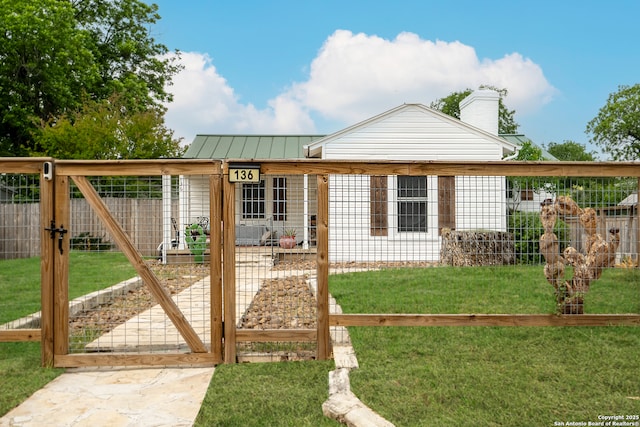 136 John Page, San Antonio, TX 78228 - single story home featuring a gate, a chimney, and metal roof