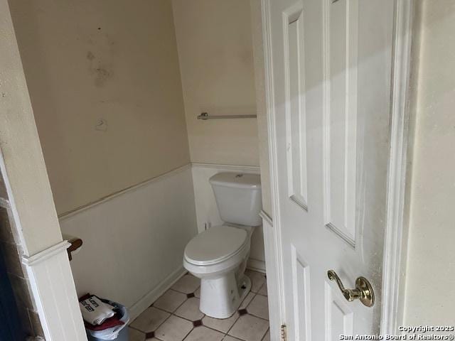 9151 Tree Vlg, San Antonio, TX 78250 - bathroom with tile patterned floors and toilet