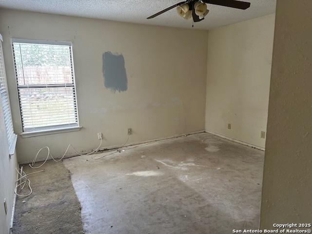 9151 Tree Vlg, San Antonio, TX 78250 - unfurnished room with a ceiling fan