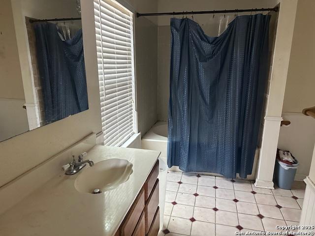 9151 Tree Vlg, San Antonio, TX 78250 - full bath with vanity, shower / tub combo with curtain, and tile patterned flooring
